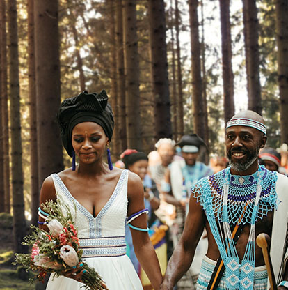 man and woman in blue Xhosa traditional outfits getting married, 